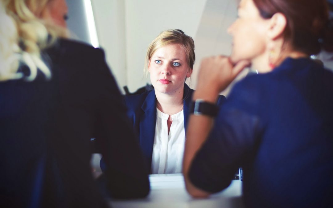 young woman listening intently in a business meeting