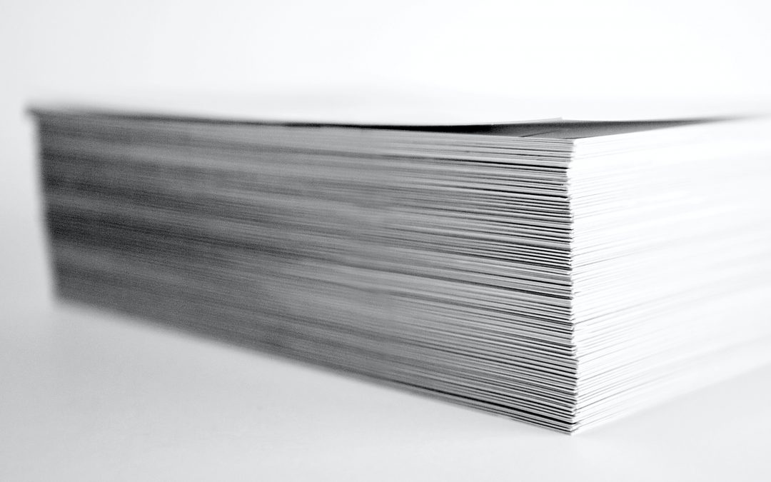 close up of a stack of important legal documents that need to be notarized