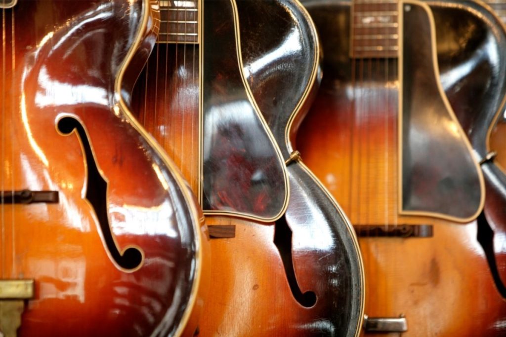 Close up on a row of guitars made in Nashville Tennessee