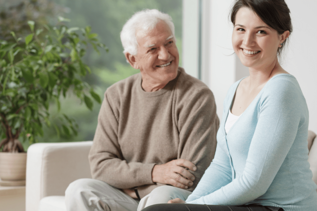 image of a smiling older gentleman sitting with his daughter. Do you know how to qualify for medicaid?