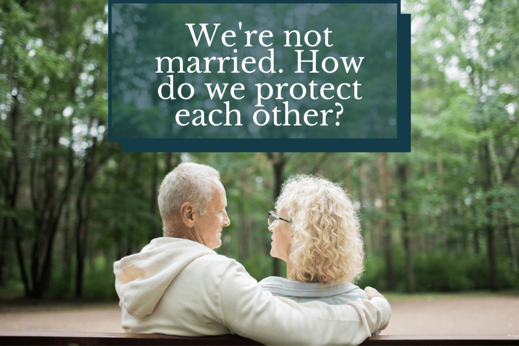 a man and woman sitting on a park bench looking at each other. They are unmarried in Tennessee and wondering what legal protections they have in place. 