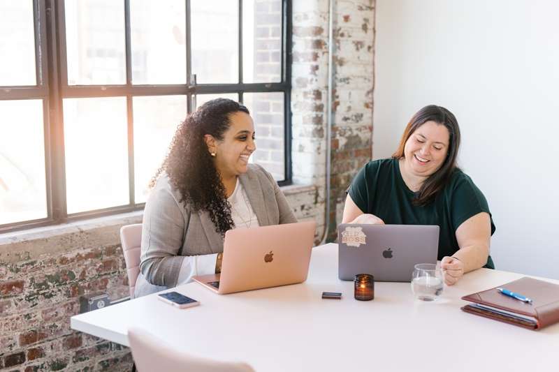 Nashville estate planning attorney and paralegal working together in a sunny office Photo credit: Feiten Photography